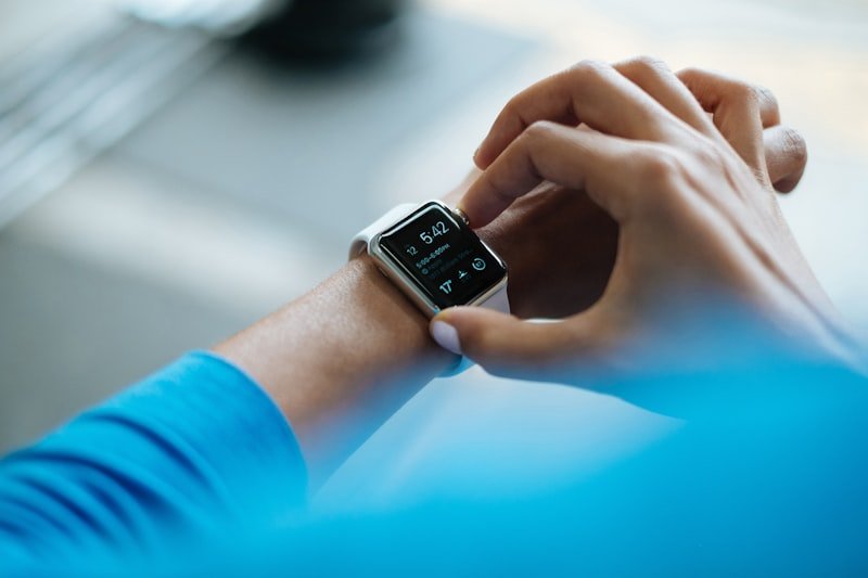 Person wearing smartwatch building identity-based healthy habits